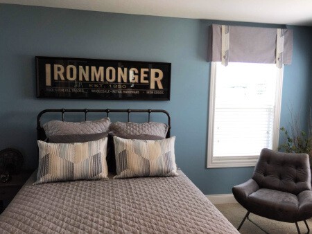 Industrial Bedroom with Iron Monger Wood Wall Sign