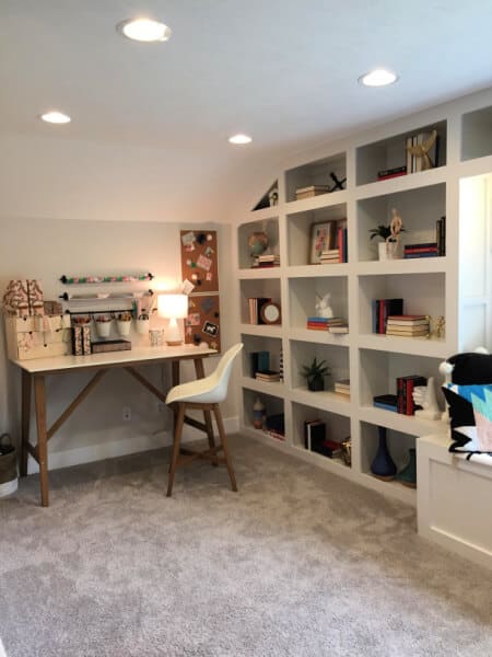 MId century modern loft office with built in wall shelves